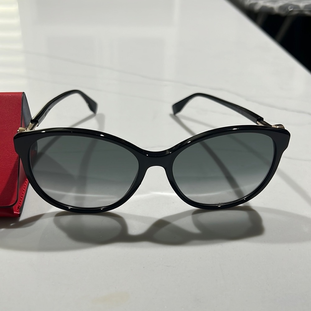 Fendi women sunglasses,NWOT,very classy &elegant.F logo on sides.comes with box.